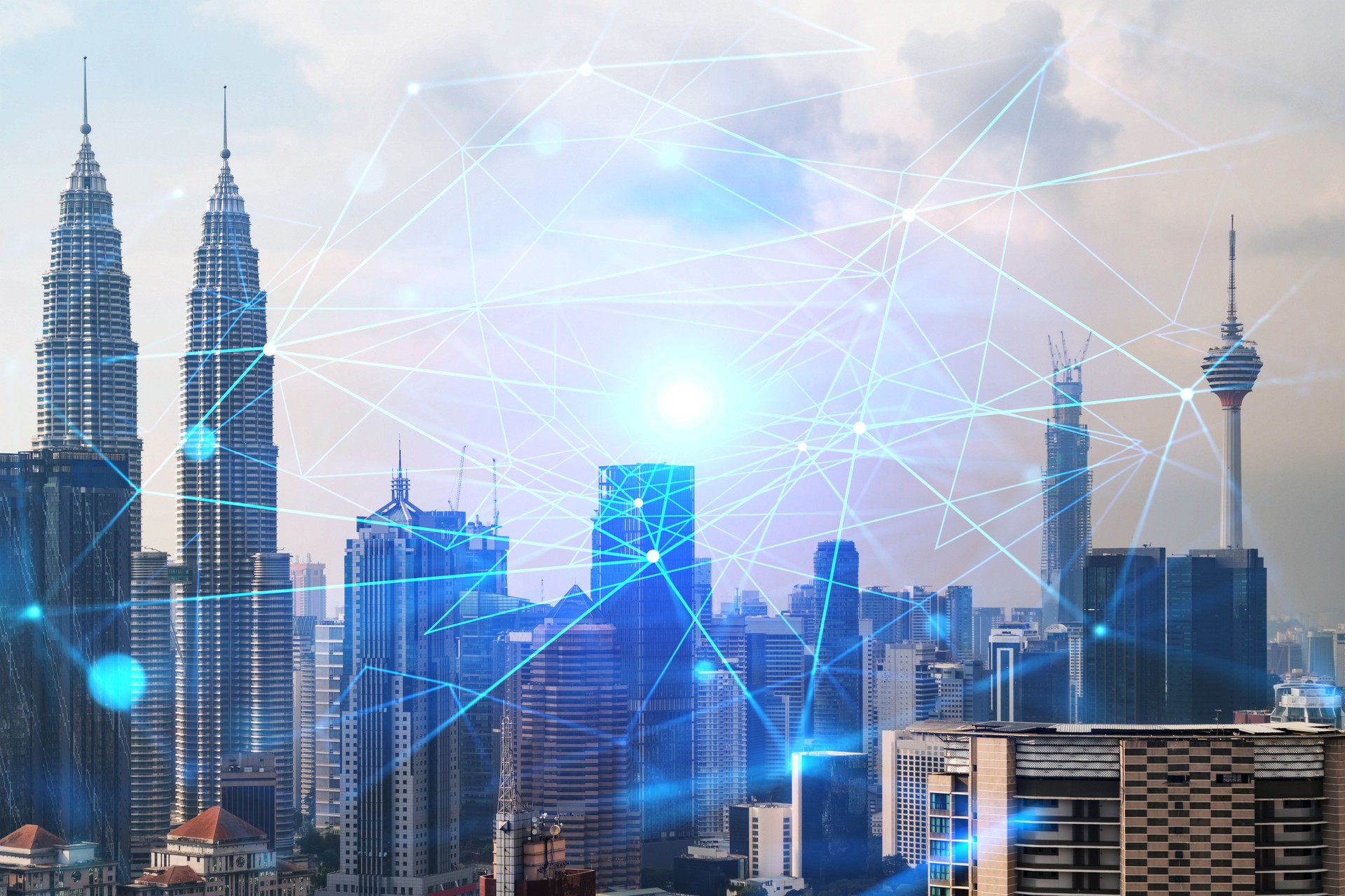 Abstract technology icons hologram over panorama city view of Kuala Lumpur, Malaysia, Asia. The concept of people networking and connections. Double exposure.